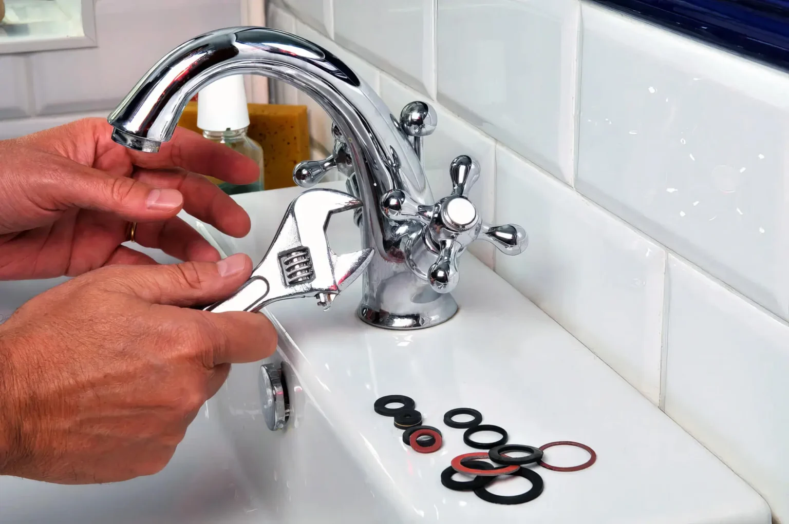 Plumber maintaining a bathroom faucet in San Fernando