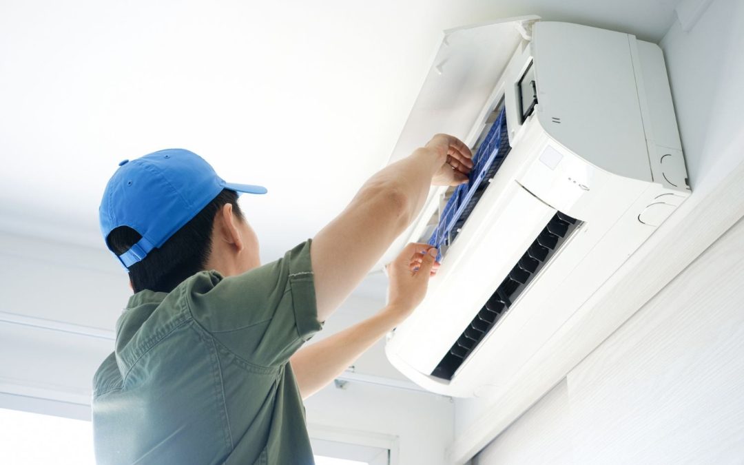 HVAC technician servicing a ductless mini split in San Fernando