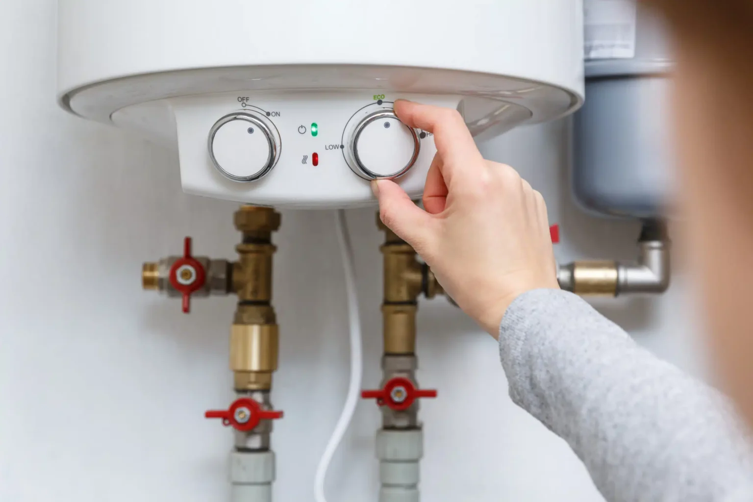 Technician adjusting a water heater in San Fernando