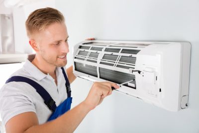 Ductless AC Maintenance San Fernando HVAC technician maintaining a ductless air conditioner in San Fernando