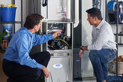 Furnace Repair or Replacement San Fernando Technician evaluating a furnace for repair or replacement in San Fernando