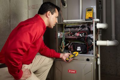 Furnace Repair San Fernando Heating technician diagnosing a furnace repair in San Fernando
