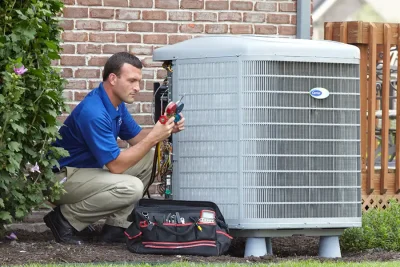 Outdoor AC Unit Inspection San Fernando HVAC technician inspecting an outdoor AC unit in San Fernando